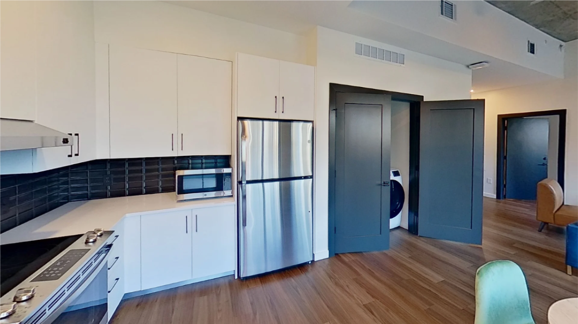 Example of microwave on countertop and modified stove buttons in an accessible layout.